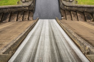 Water flowing down the dam of a reservoir