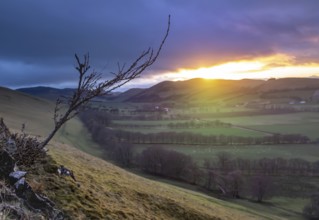 A Beam Of Light From A Winter Sunset Illuminating The Gentle Landscape Of An Agricultural Valley In