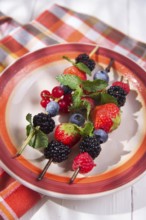 Presentation set of skewers of berries, summer dish
