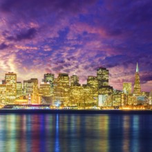 San Francisco sunset skyline in California with reflection in bay water USA
