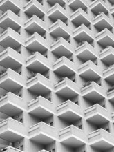 High rise building with residential flats or apartments in a white concrete development with