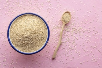 Quinoa in a bowl, healthy organic wood, uncooked, shot from above with copy space, Food