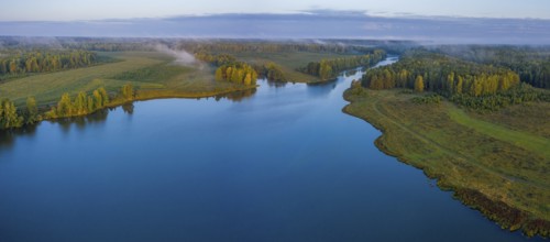 Sunset aerial atmospheric view on river in Ural Russia. Drone photography