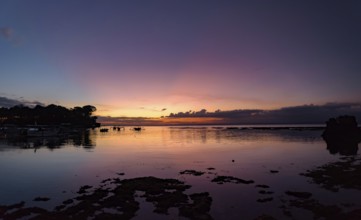Sunset at Mushroom Beach with boats on the sea, Lembongan, Bali, Indonesia, Asia