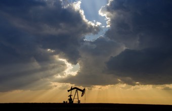 Prairie Storm Clouds Saskatchewan oil pump jack