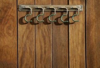Rural hanger over wooden wall, horse stables