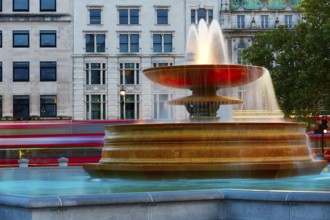 London Trafalgar Square fountain at sunset England