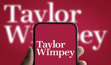Dhaka, Bangladesh- 5 Dec 2024: Taylor Wimpey logo is displayed on smartphone. Taylor Wimpey plc is