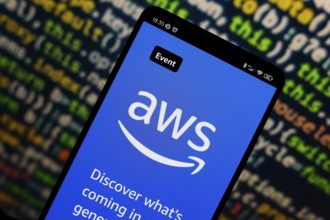 In this photo illustration, the Amazon Web Services (AWS) logo is displayed on the website on the