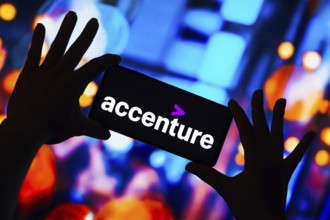 In this photo illustration, the Accenture logo is displayed on a smartphone screen