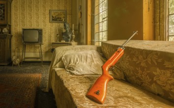 A nostalgic bedroom with a retro TV and a rifle on the sofa, Maison Limmi, Lost Place, Kalken,