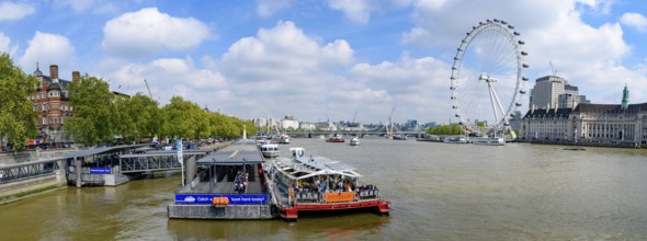 Panorama of Westminster Millennium Pier on the north bank of the River Thames with London Eye at