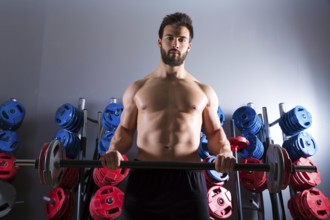 Barbell beard man workout fitness at weightlifting gym