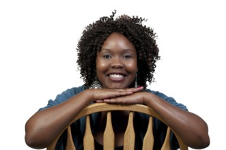 A very beautiful African American woman with a big smile