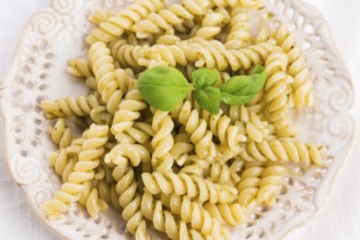 Italian fusilli pasta and fresh homemade pesto sauce