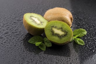 Juicy kiwi fruit and freas mint leaves