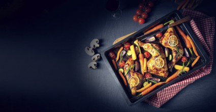 Grilled chicken legs with various vegetables and herbs
