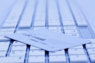 Close-up of a credit card for cashless payment and keyboard. Symbol photo for shopping on the