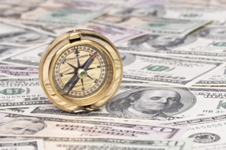 Many dollar banknotes and compass Austria