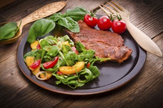 Cervical chop with apricot-rocket salad