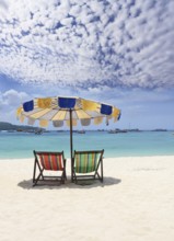 Paradise rest on a beach. Elegant beach chaise lounges on a beach of Rajlej near to Krabi,