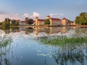 Rheinsberg Castle on Lake Lake Grienerick in the last evening light, Rheinsberg, Brandenburg,