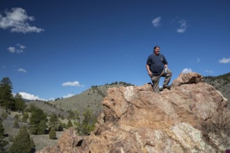 Idledale, Colorado - A hiker stands at a high point on the Bruin Bluff Trail in Lair o' the Bear