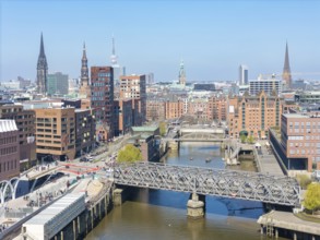 Aerial view of Hamburg's HafenCity with a view of Magdeburg harbour under a clear blue sky,