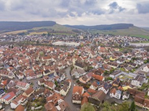 Aerial view of a village with red roofs and hills in a rural setting, Großbottwar, Ludwigsburg
