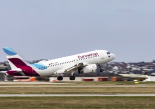 Stuttgart Airport STR EDDS. Manfred Rommel Airport. Eurowings aircraft taking off. Airbus A319-100
