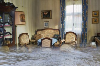 Photomontage: insurance damage, room under water, flood, flooding, household contents insurance,