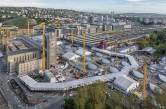 Stuttgart main station with Bonatzbau. Stuttgart 21 construction site with station tower and crane.