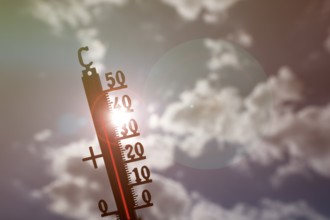 Symbolic image heat wave, thermometer in the sun, summer, climate change, temperature, record heat,