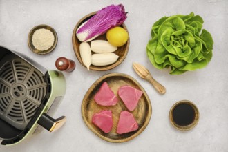 Ingredients for tuna steaks with fresh healthy salad ready for preparation in air fryer