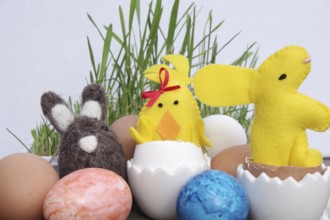 Easter, Easter decoration, Easter egg, Easter bunny, colourful, Coloured eggs and figures lie