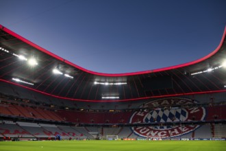 Evening match Allianz Arena, interior, illuminated, logo FC Bayern Munich, blue hour, UEFA