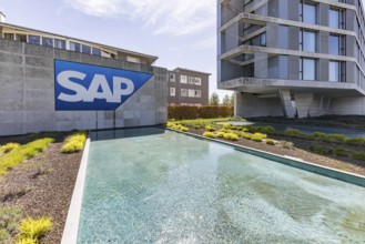 Logo and building of the listed software company SAP, headquarters. Walldorf, Baden-Württemberg,