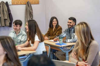 Cheerful university students enjoying their time in the classroom, actively participating and