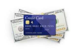 Thirty thousand dollars stack of one hundred dollar bills with a credit card on top isolated on a