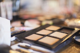 Assorted makeup products macro with shallow depth of field. Natural light