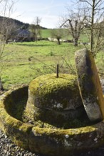 Old millstones in the national park community of Weiden near the Hunsrück-Hochwald National Park in