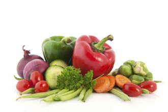 Still life with fresh vegetables isolated over white background