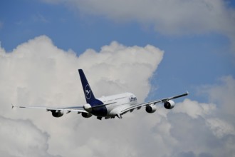 Lufthansa Airbus A380-800 taking off with blue sky and clouds, runway, Munich Airport, Upper