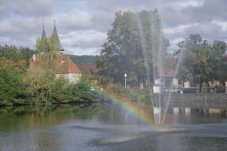 View from the Feuersee lake to the town church, rainbow, water feature, water fountain,