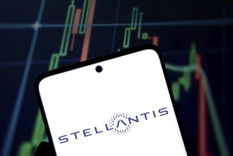 Stellantis logo is displayed on smartphone. Stellantis is a multinational automotive manufacturing