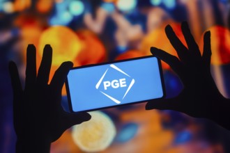In this photo illustration, the Portland General Electric (PGE) logo is displayed on a smartphone