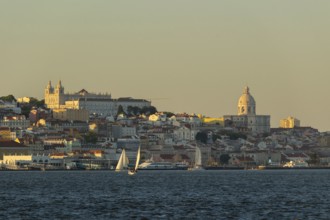 Lisbon City Center Skyline and Tagus River at Sunset. National Pantheon and Sailboats. Portugal