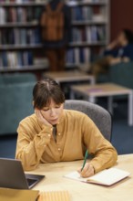 Girl studying university library