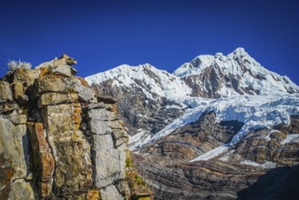 Photo of rocky mountains and Alpamayo, one of peaks of Peruvian Andes in Parque Nacional Huascaran