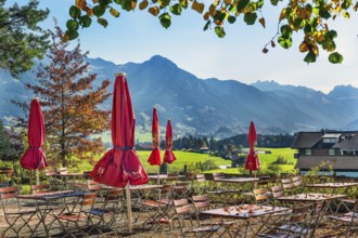Autumn beer garden with parasols on the Schweineberg, Allgäu Alps near Ofterschwang, Allgäu,